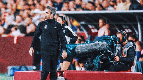 Spain soccer coach faces scrutiny for touching a female assistant while celebrating