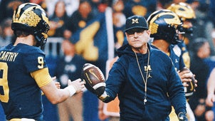 NEXT Trending Image: Michigan QB wears 'Free Harbaugh' shirt, leads tribute to suspended coach