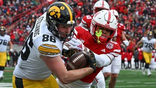 COLLEGE FOOTBALL Trending Image: Iowa-Michigan opens up as lowest total ever in a conference title game