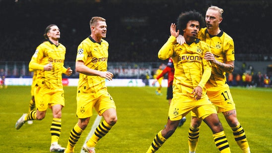 Dortmund advances to last 16 of Champions League with 3-1 win at Milan