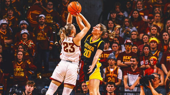 Caitlin Clark's 35 points and key assists help fourth-ranked Iowa escape Iowa State 67-58