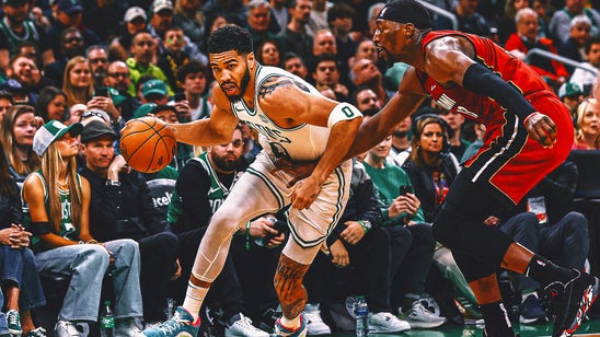 Jayson Tatum's triple-double leads Celtics past Heat 114-94 in playoff opener
