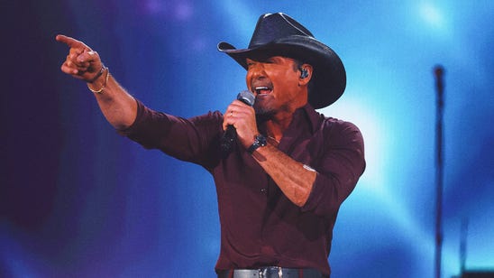Country music star Tim McGraw reps Caitlin Clark Fever jersey at concert