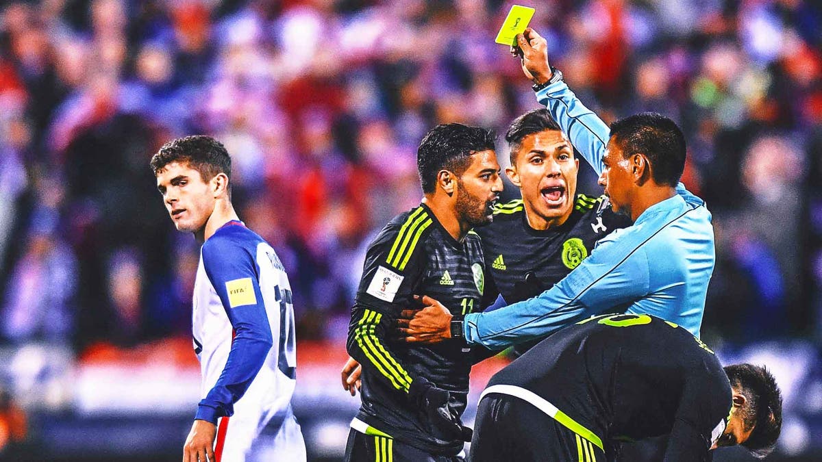 Christian Pulisic, 18 at the time, looks on as Mexico's Carlos Salcedo is given a yellow card during a World Cup qualifier in 2016. <i>(Photo by Jamie Sabau/Getty Images)</i>