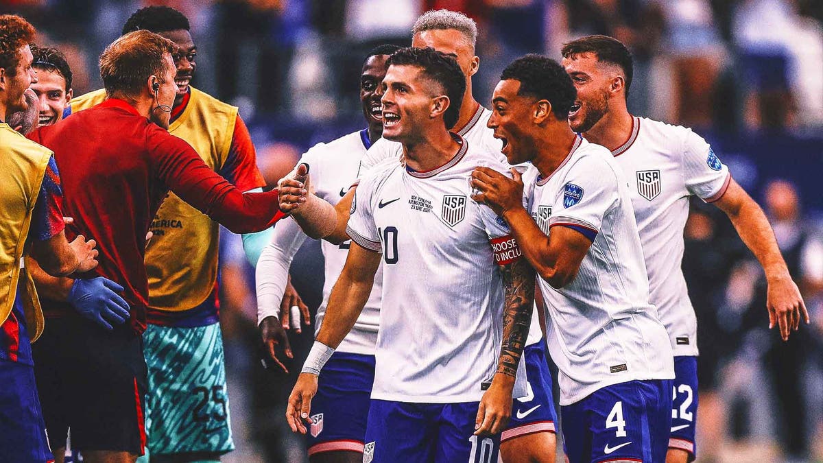 Christian Pulisic celebrates with Tyler Adams (4) and other teammates after scoring against Bolivia on Sunday. <i>(Photo by Omar Vega/Getty Images)</i>