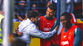 Cristiano Ronaldo grabbed by a fan in chaotic public training session