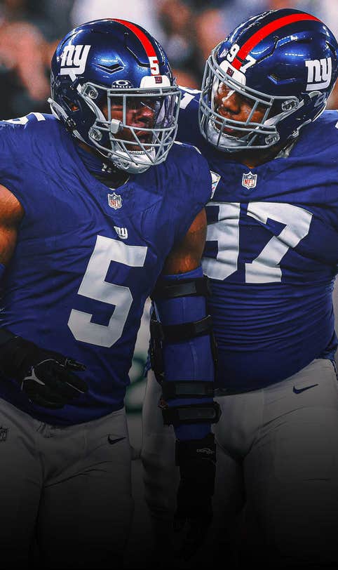 Front-loaded: Giants happily putting heavy pressure on their four-man D-line