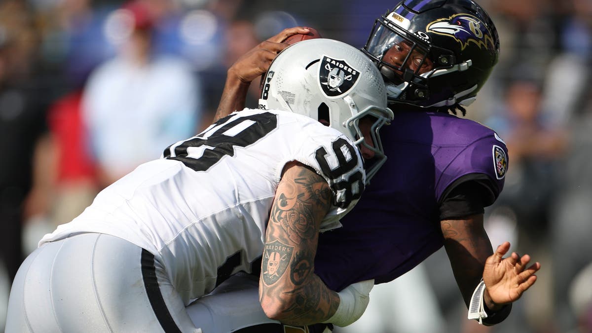 Maxx Crosby sacks QB Lamar Jackson during the Raiders' Week 2 win over the Ravens. (Getty Images)