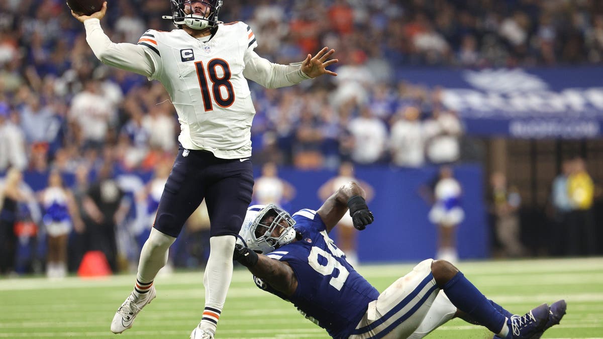 Tyquan Lewis of the Colts pressures Bears QB Caleb Williams during Sunday's Week 3 contest. (Photo by Michael Hickey/Getty Images)