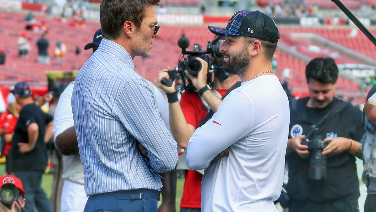 Tom Brady talks to Bucs QB Baker Mayfield before the game Sunday. Mayfield threw for 347 yards and two TDs, earning Brady's LFG Player of the Game. (Photo by Cliff Welch/Icon Sportswire via Getty Images)
