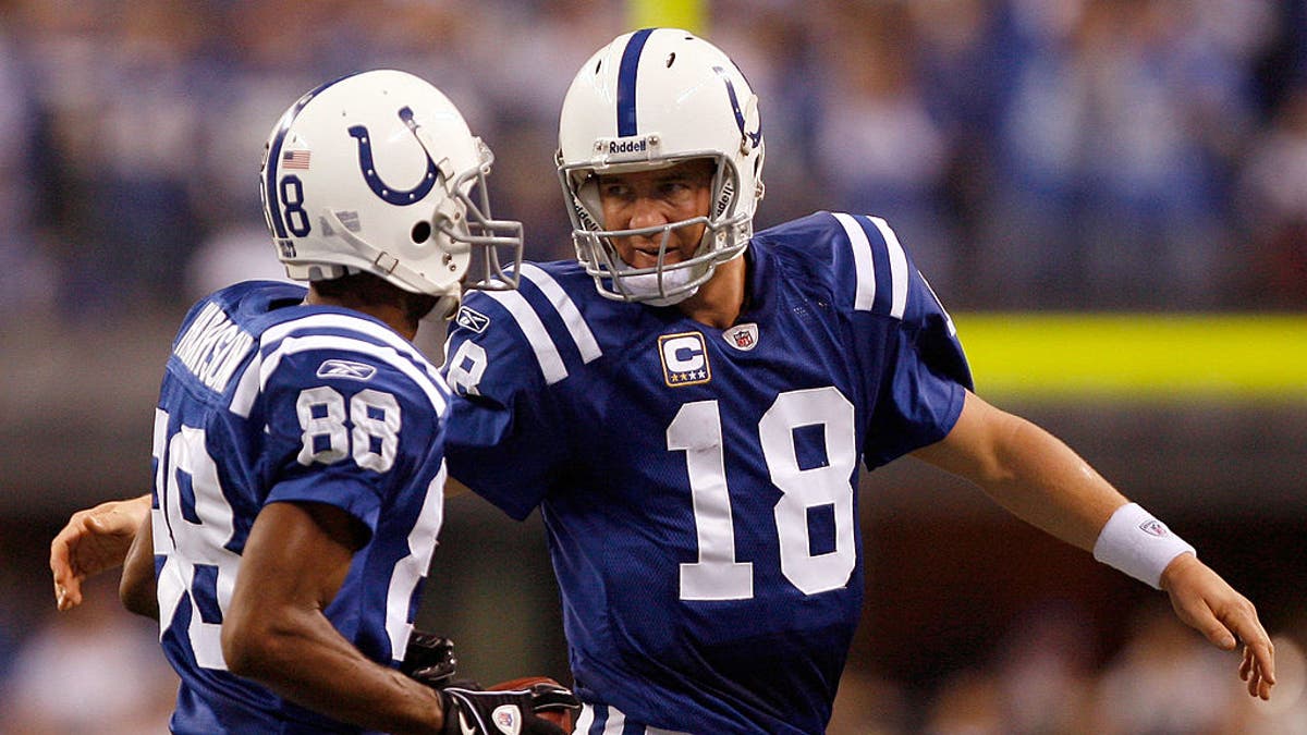 Peyton Manning and Marvin Harrison Sr. connected for 112 career touchdowns with the Colts, the NFL record for a QB-WR tandem. (Photo by Harry How/Getty Images)