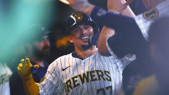 Brewers clinch third NL Central title in four years after Cubs lose to A's