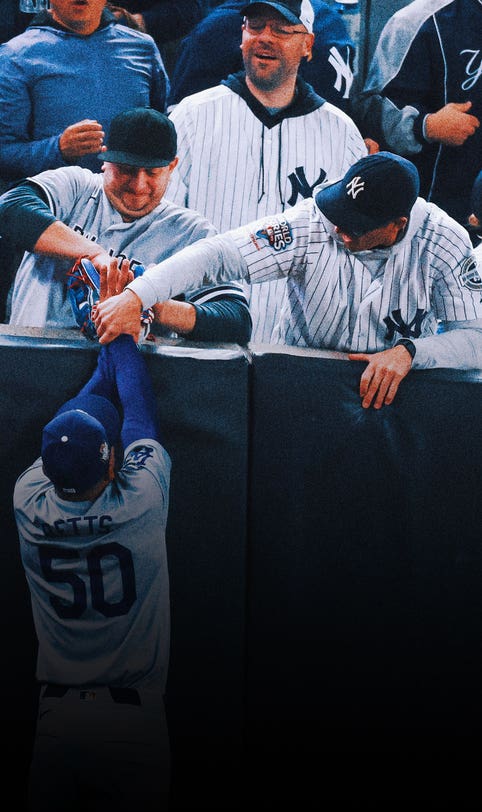 Yankee Stadium fan ejected for interference by prying ball out of Mookie Betts' glove at World Series