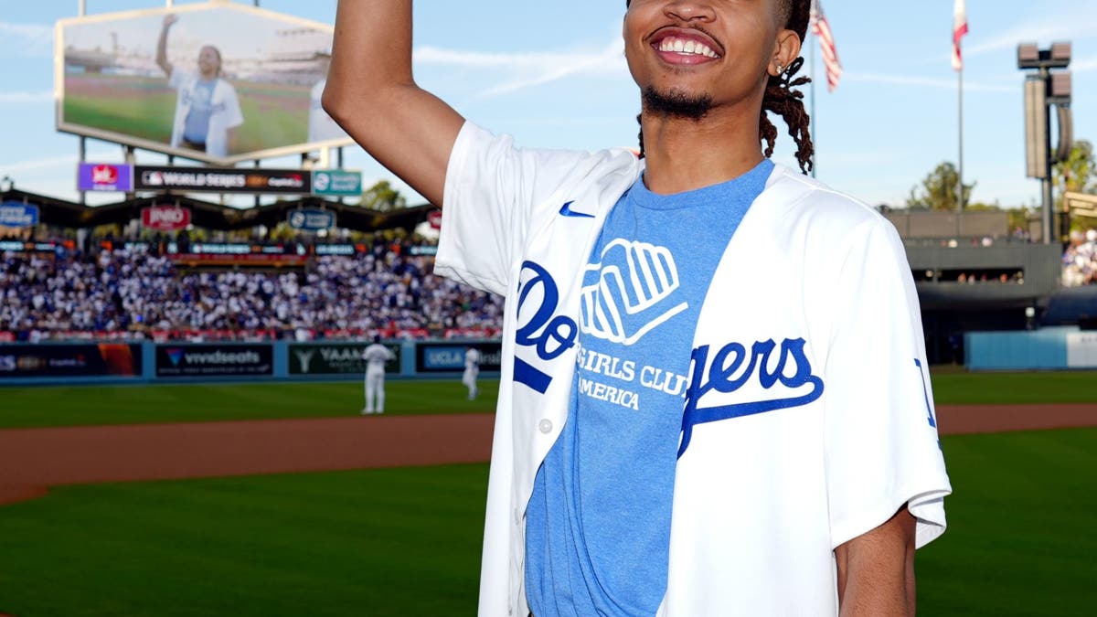First ball deliverer from the Boys and Girls Club of America Nico F. acknowledges the crowd prior to Game 2 of the 2024 World Series. (Photo by Daniel Shirey/MLB Photos via Getty Images)