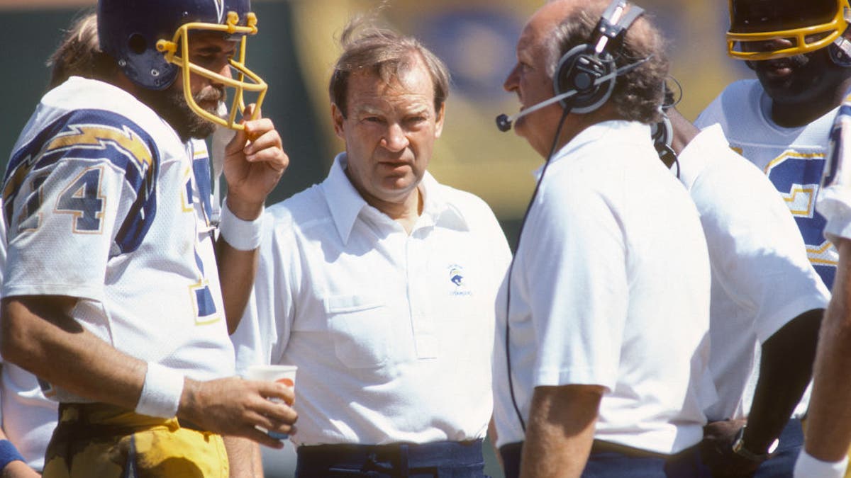 Dan Fouts' Hall of Fame career took off when Don Coryell (center) brought his pass-heavy scheme to the Chargers. (Photo by Focus on Sport/Getty Images)