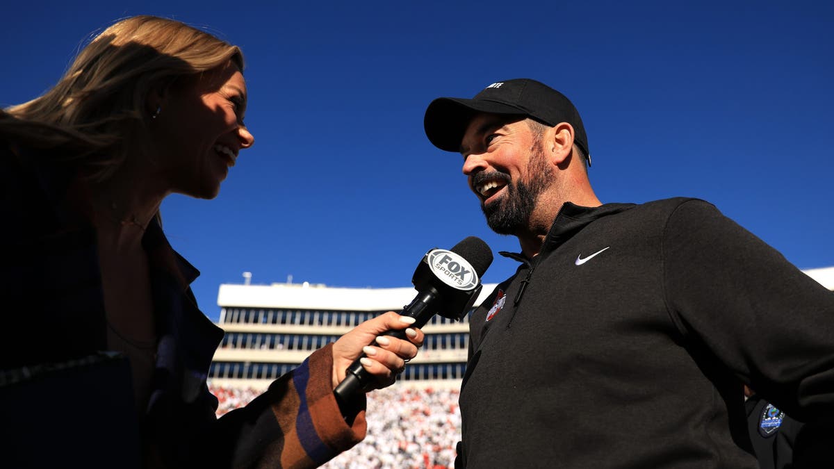 Ohio State head coach Ryan Day speaks with FOX Sports' Jenny Taft following the Buckeyes' win over Penn State. (Photo by Scott Taetsch/Getty Images)
