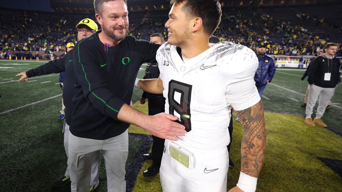 Oregon head coach Dan Lanning and quarterback Dillon Gabriel have guided the Ducks to a 10-0 record, putting them in the driver's seat in the Big Ten title race. (Photo by Gregory Shamus/Getty Images)