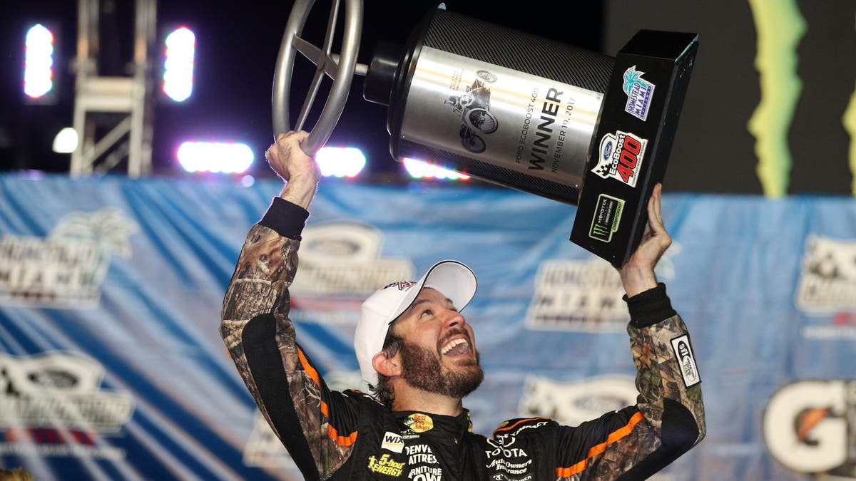 Martin Truex Jr. celebrates after winning the 2017 NASCAR championship at Homestead. (Photo by Chris Graythen/Getty Images)