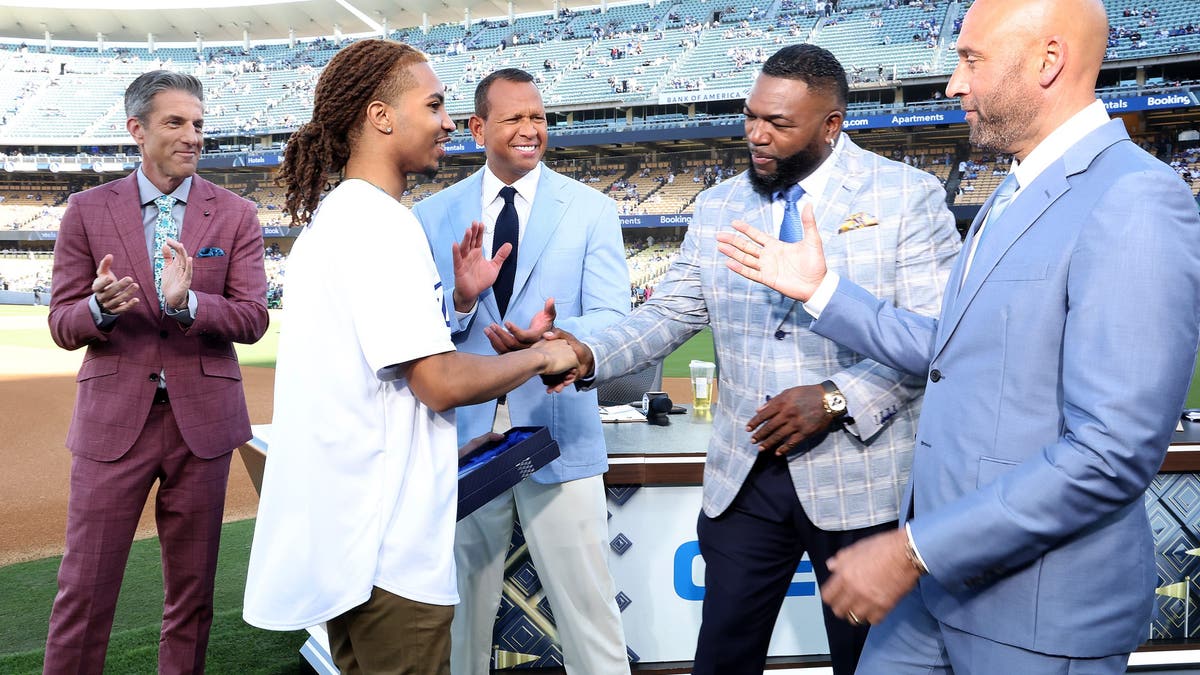 Boys &amp; Girls Clubs of America's 2024-25 National Youth of the Year Nico F. is congratulated by the "MLB on FOX" crew after his hometown club received the FOX Sports World Series scholarship in his honor. (Photo by FOX Sports)
