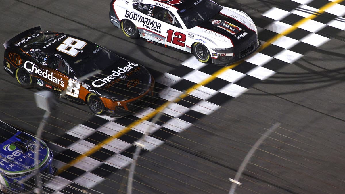 Daniel Suarez, Kyle Busch and Ryan Blaney race to the finish line at Atlanta. (Photo by Jeff Robinson/Icon Sportswire via Getty Images)