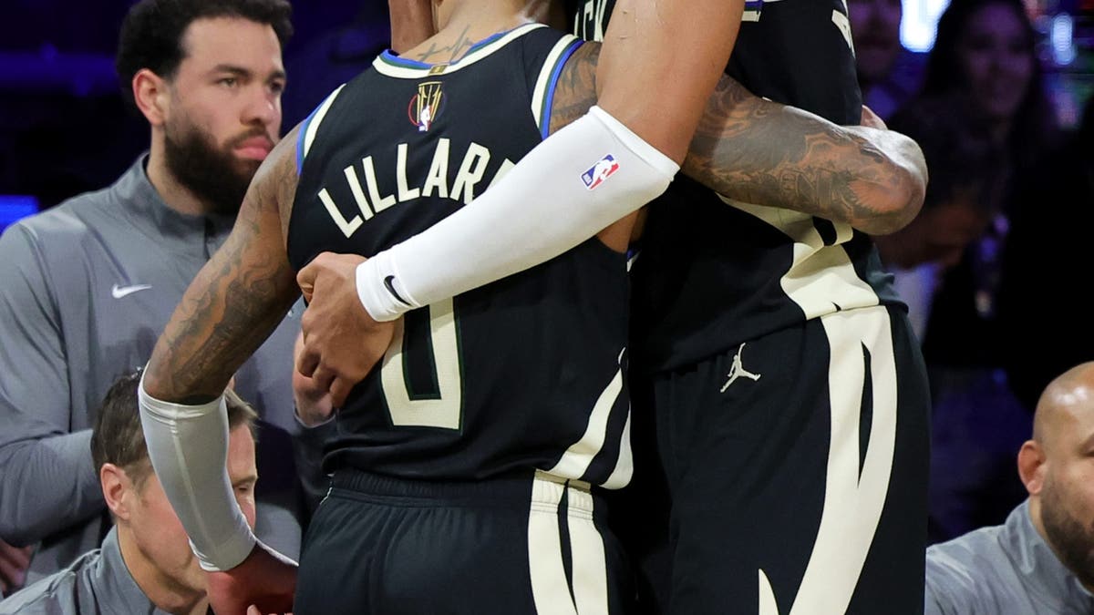 Damian Lillard and Giannis Antetokounmpo share a hug after winning the NBA Cup. (Photo by Ethan Miller/Getty Images)