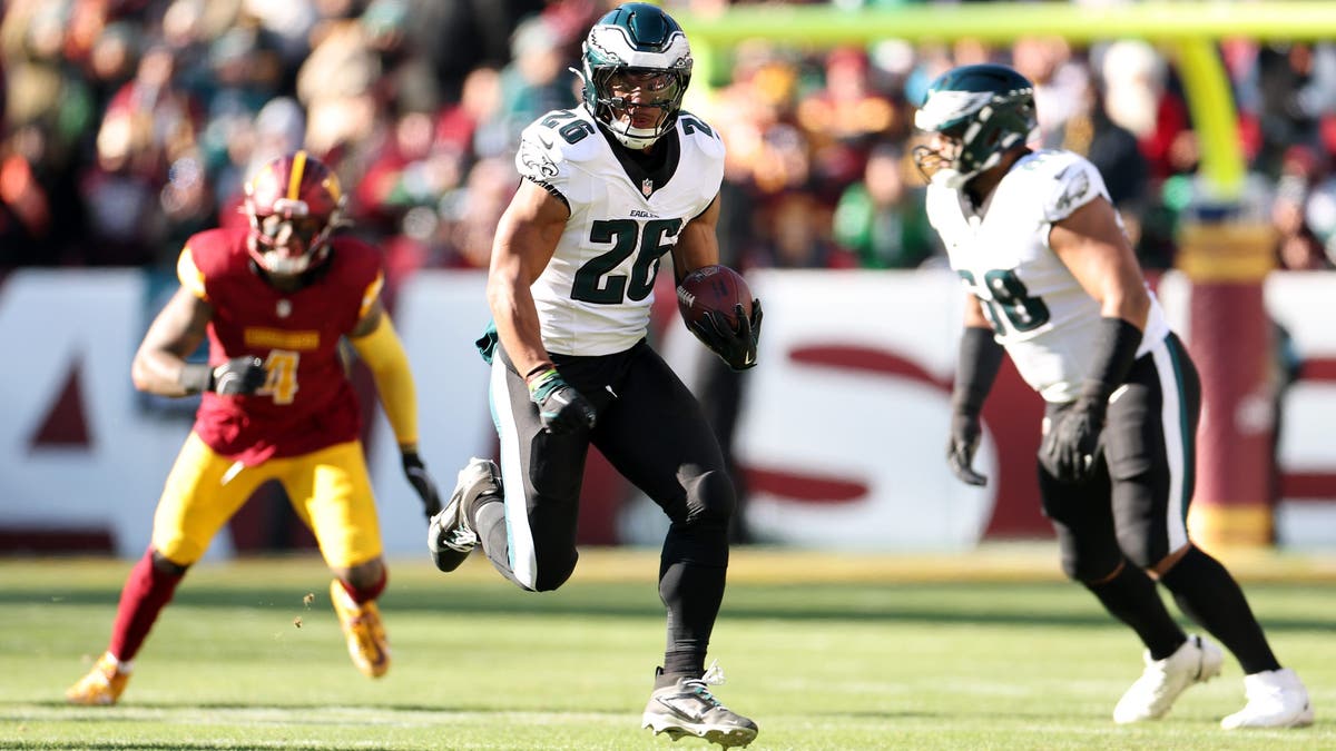 Saquon Barkley had a big game in the Eagles' loss to the Commanders, rushing for 150 yards and two touchdowns. (Photo by Scott Taetsch/Getty Images)