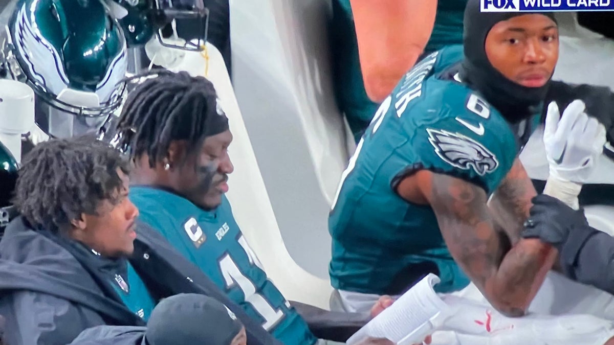 A.J. Brown is captured by the FOX cameras reading a book during Sunday's playoff game.