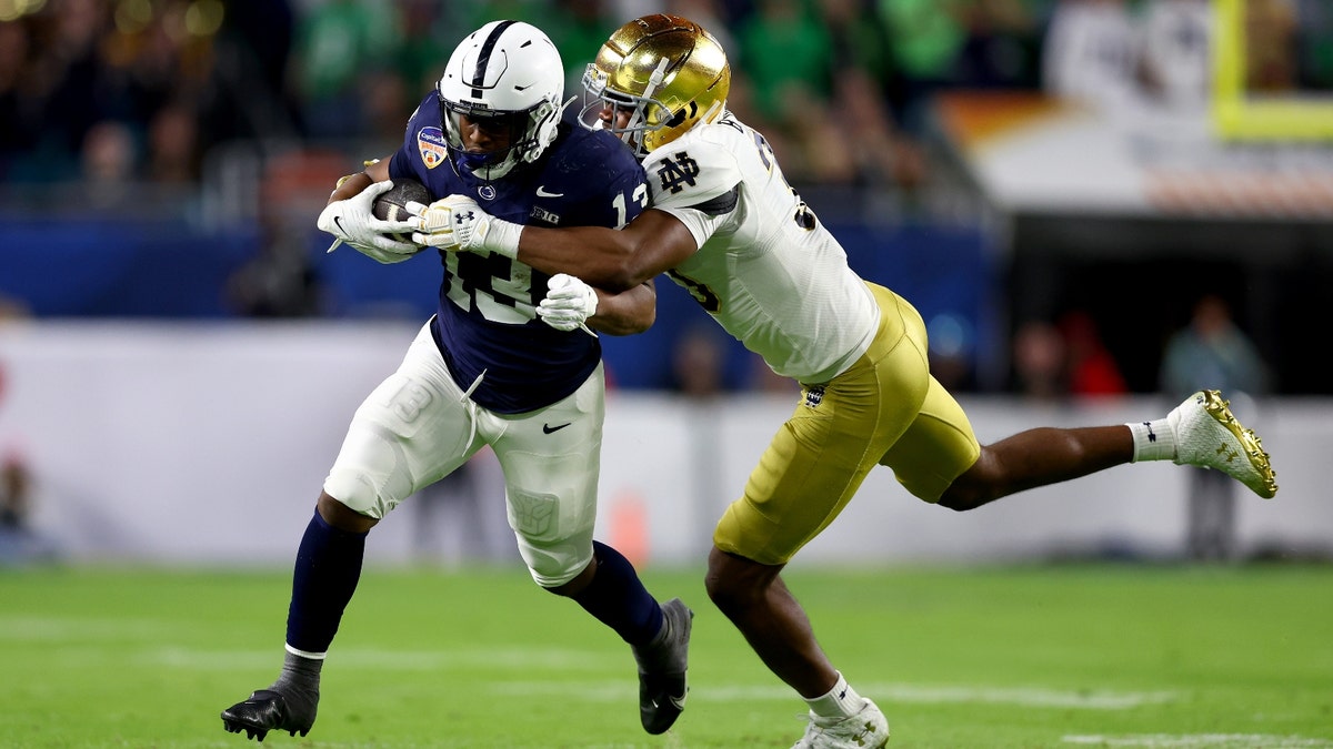 Kaytron Allen #13 of the Penn State Nittany Lions runs the ball against Notre Dame in the Capital One Orange Bowl. (Photo by Megan Briggs/Getty Images)