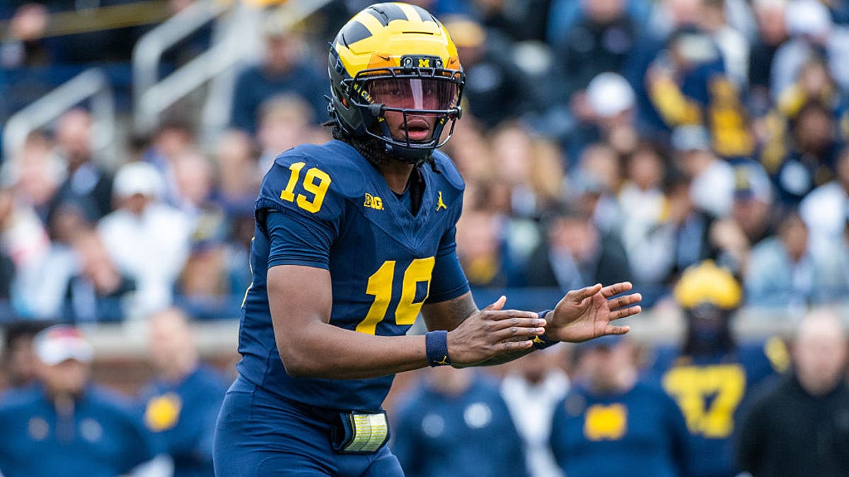 Bryce Underwood #19 of the Michigan Wolverines prepares to receive the ball during the second half of the Michigan Maize vs Blue Spring Football Game. (Photo by Aaron J. Thornton/Getty Images)