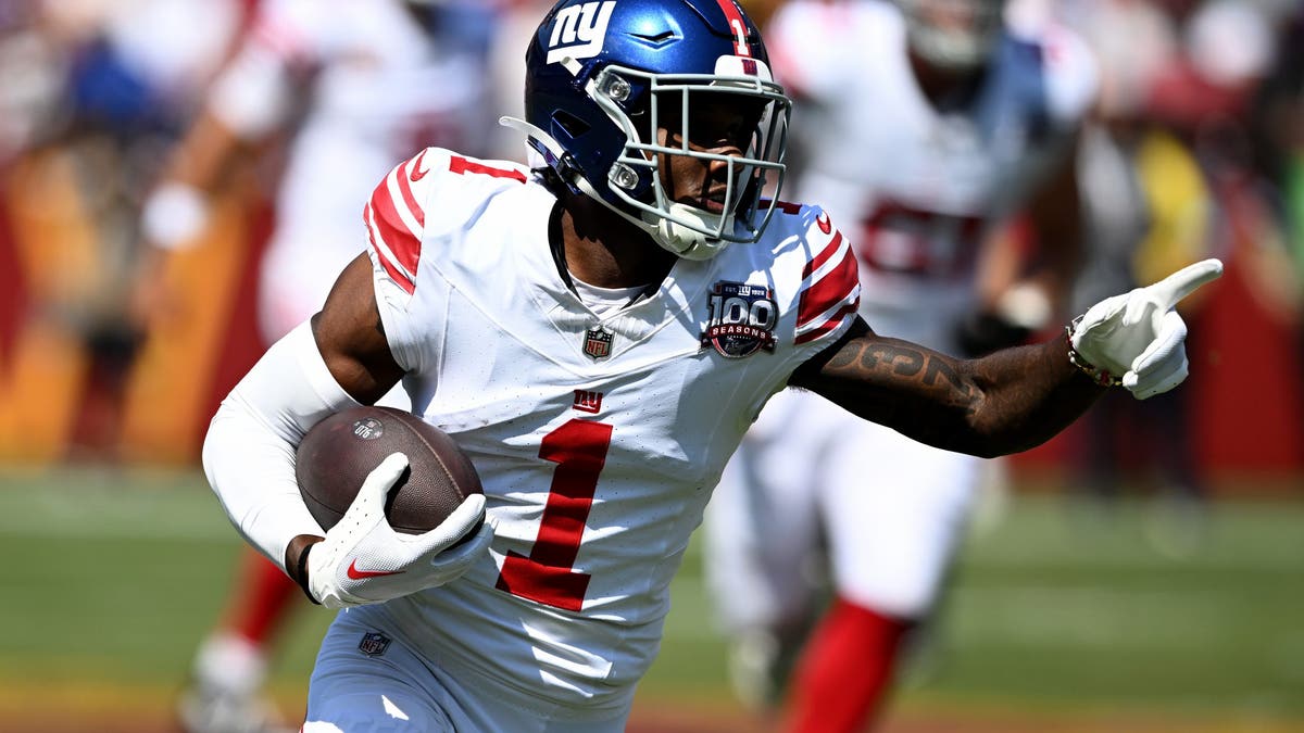 Malik Nabers #1 of the New York Giants runs with the ball after a catch against the Washington Commanders at Northwest Stadium on September 15, 2024 in Landover, Maryland. (Photo by G Fiume/Getty Images)