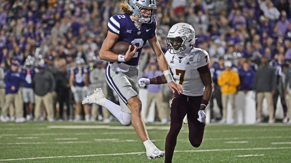 Kansas State QB Avery Johnson had 605 rushing yards and seven rushing scores to go with 2,712 passing yards, 25 passing touchdowns and 10 interceptions in his first season as Kansas State's starting quarterback. (Photo by Peter Aiken/Getty Images)