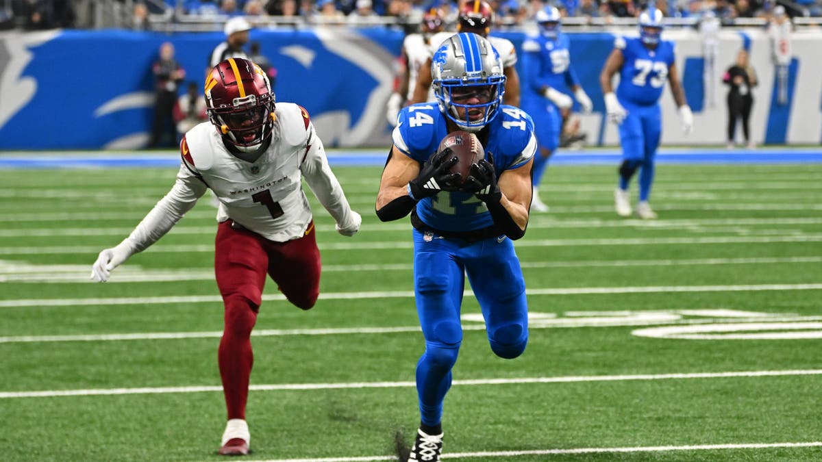 Detroit Lions wide receiver Amon-Ra St. Brown (14) makes an over the shoulder catch for a long first down during the NFC Divisional Playoff game against the Washington Commanders on Sunday January 18, 2025 at Ford Field in Detroit, MI. (Photo by Steven King/Icon Sportswire via Getty Images)