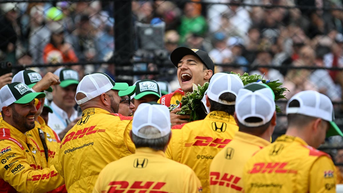 Alex Palou celebrates with his Chip Ganassi Racing team. (Photo by Brandon Badraoui/Lumen via Getty Images)