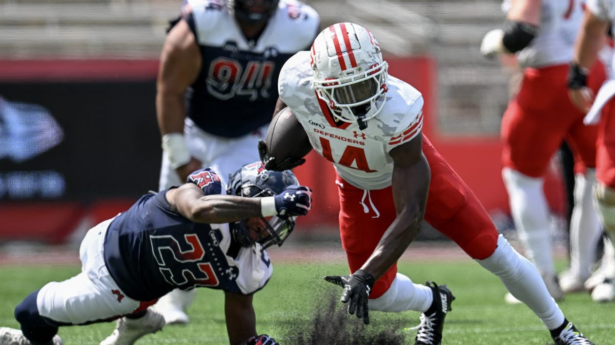 Cornell Powell #14 of the DC Defenders breaks a tackle in the second quarter of a game at TDECU Stadium on May 25, 2025, in Houston, Texas. (Photo by Jack Gorman/UFL/Getty Images)