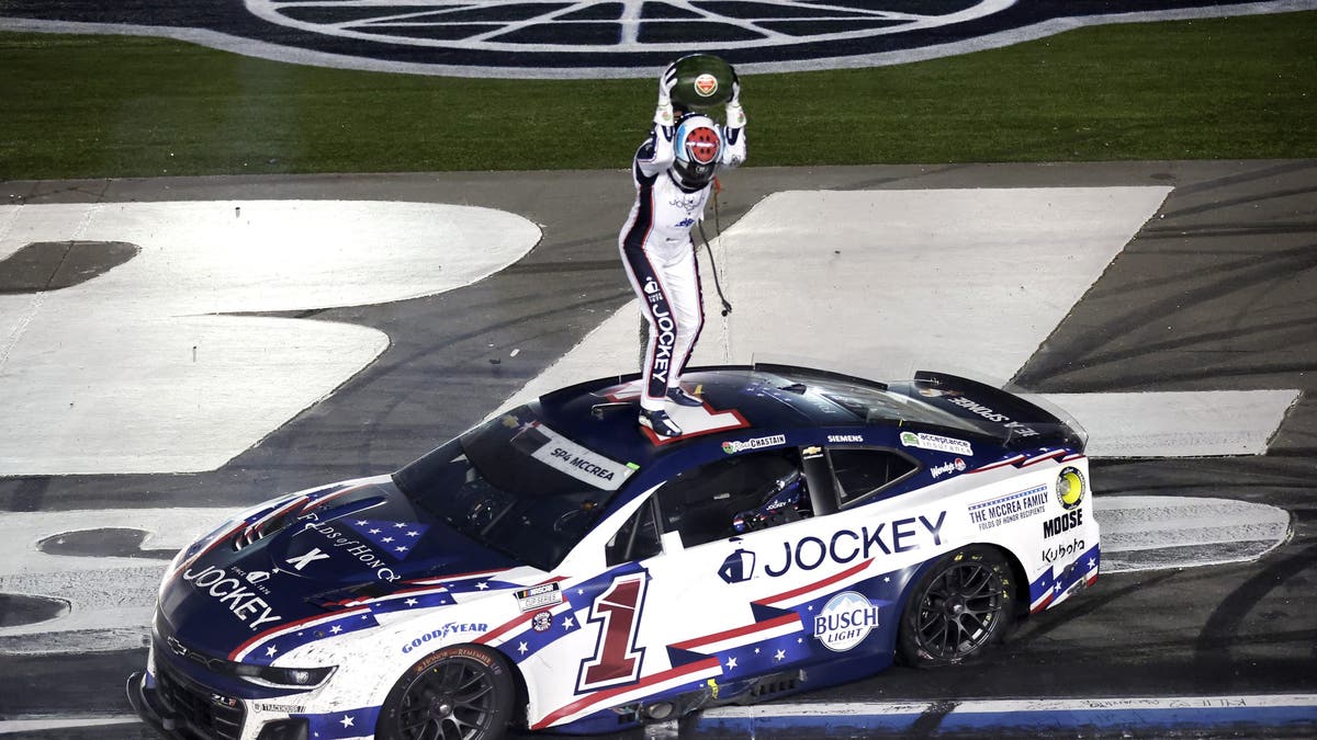 Ross Chastain celebrates his historic Coca-Cola 600 victory by smashing a watermelon. (Photo by Logan Riely/Getty Images)