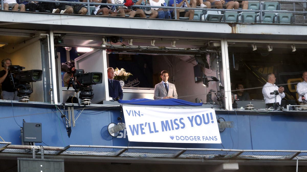 Part of what made Joe Davis' iconic World Series call was the nod to broadcasting legend Vin Scully. (Gary Coronado / Los Angeles Times via Getty Images)