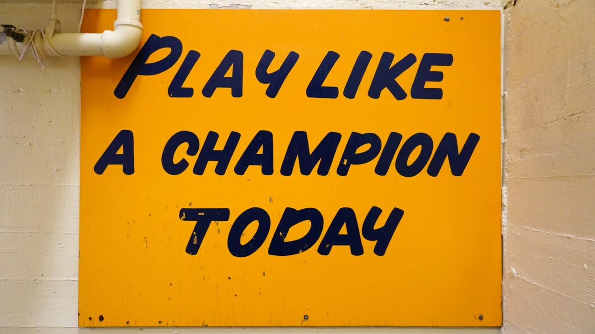 The 94-year-old Notre Dame Stadium has gone through plenty of renovations over the years, but the iconic "Play Like A Champion Today" sign that its players tap before taking the field remains. (Photo by Erick W. Rasco /Sports Illustrated via Getty Images).