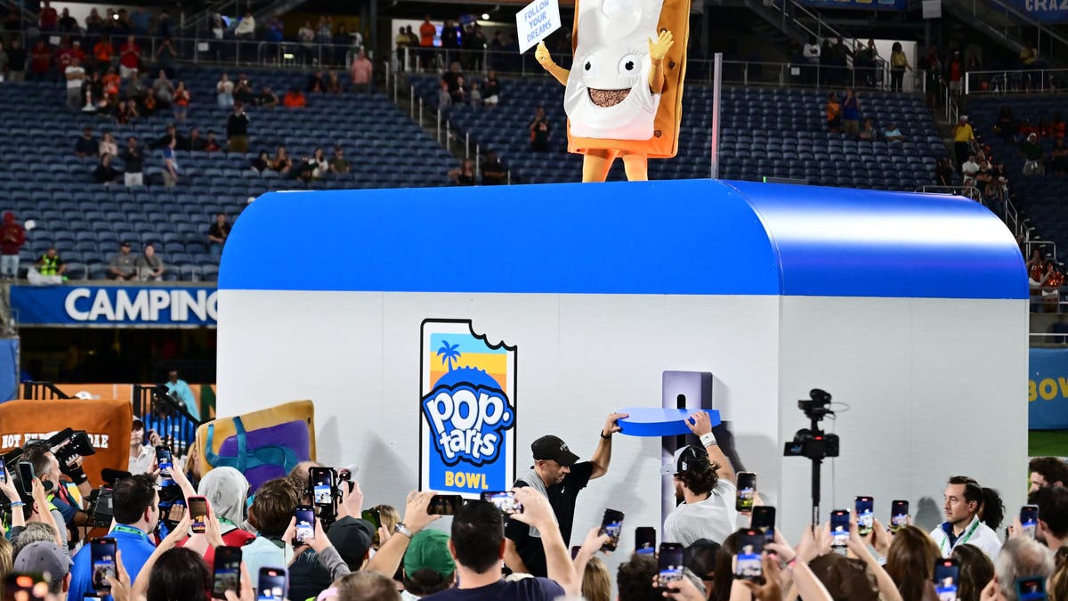The Pop-Tarts mascot goes through the toaster at during the Pop-Tarts Bowl celebration. (Photo by Julio Aguilar/Getty Images)