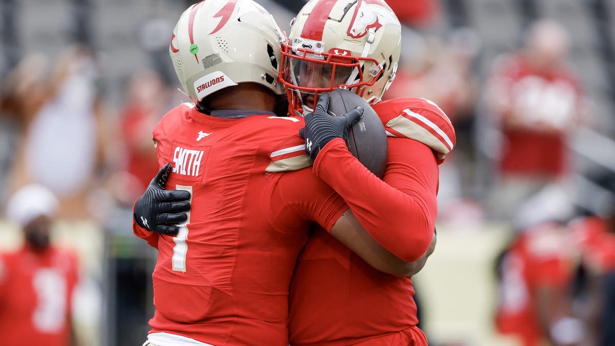 J'Mar Smith #1 and Marcus Baugh #85 of the Birmingham Stallions hug after their team's 33-25 victory against the Houston Roughnecks. (Photo by Butch Dill/UFL/Getty Images)
