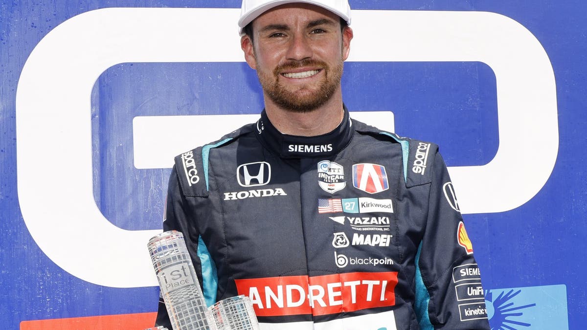Kyle Kirkwood celebrates after winning in Detroit.