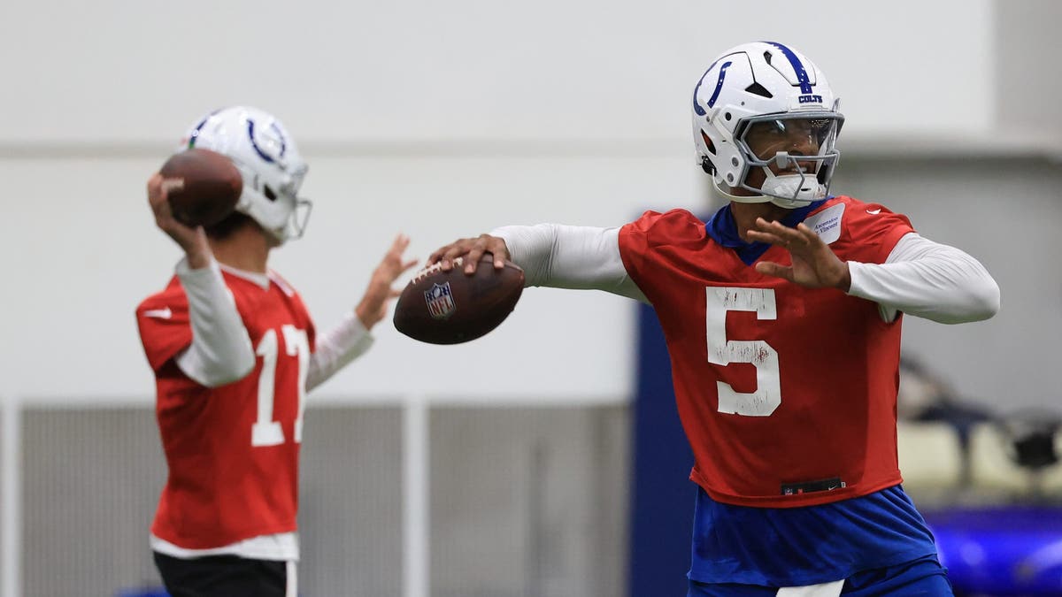 Anthony Richardson #5 and Daniel Jones #17 of the Indianapolis Colts throw a pass during the Indianapolis Colts OTAs at Indiana Farm Bureau Football Center on May 28, 2025 in Indianapolis, Indiana. (Photo by Justin Casterline/Getty Images)
