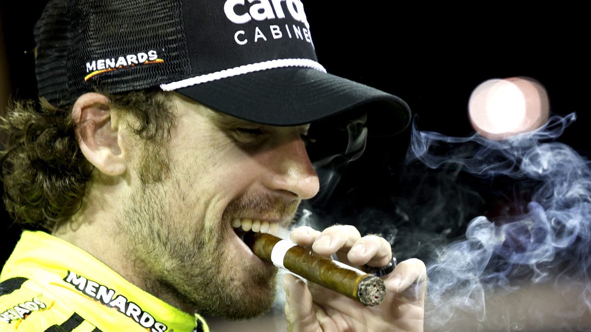 Ryan Blaney celebrates with a cigar in Nashville.
