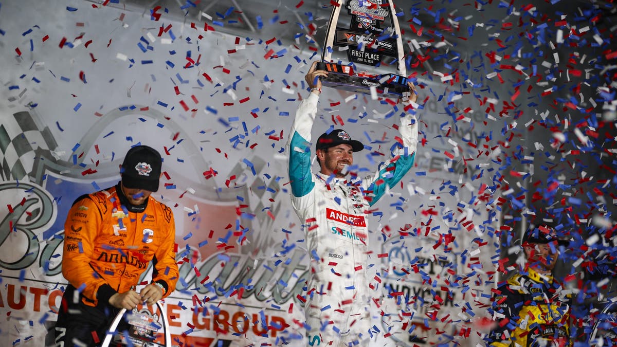 Kyle Kirkwood celebrates on podium with confetti after winning the Bommarito Automotive Group 500?