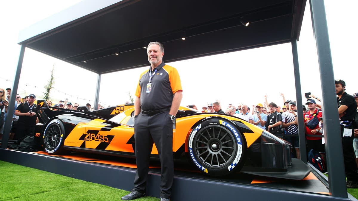 McLaren Racing CEO Zak Brown poses with the new McLaren United Hypercar to debut in 2027 ahead of the 24 Hours of Le Mans at the Circuit de la Sarthe?