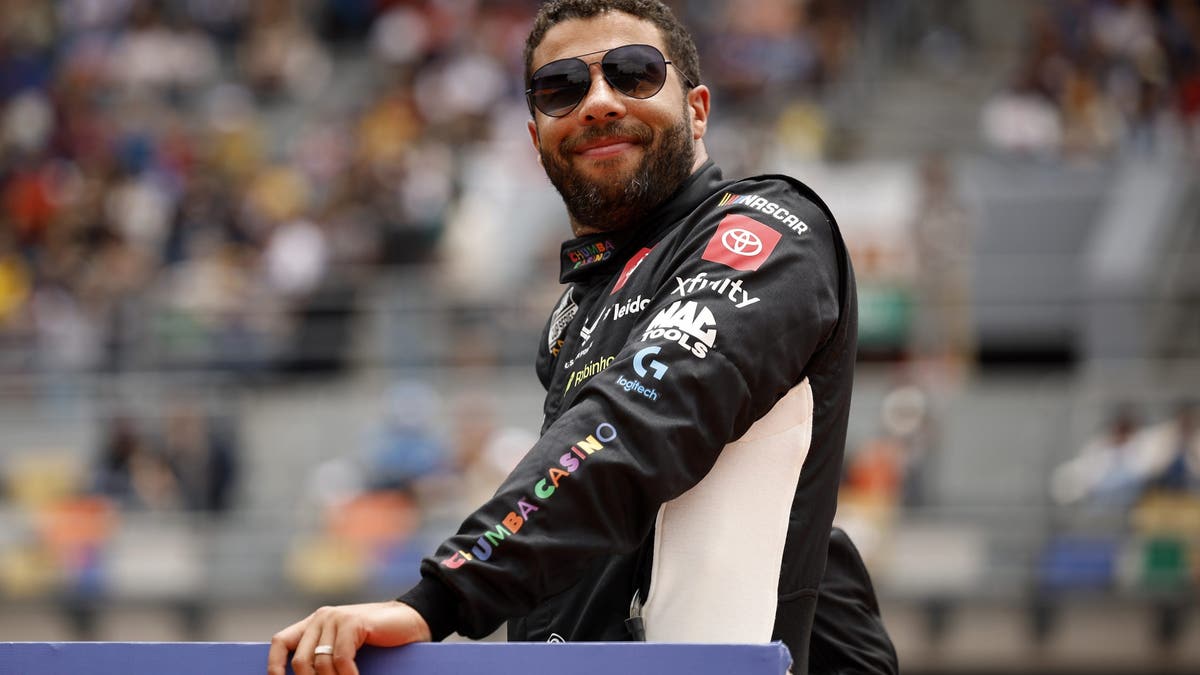 Bubba Wallace looks on during pre-race ceremonies prior to the NASCAR Cup Series Viva Mexico 250