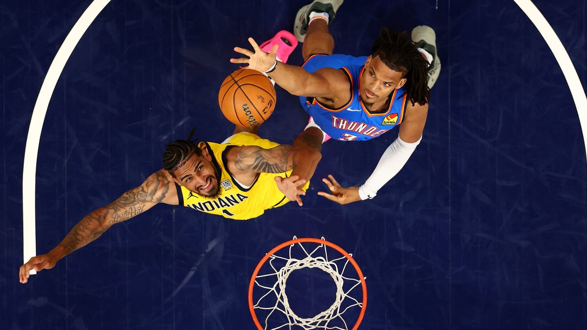 Dillon Jones of the Oklahoma City Thunder and Obi Toppin of the Indiana Pacers fight for a rebound during the fourth quarter in Game 6
