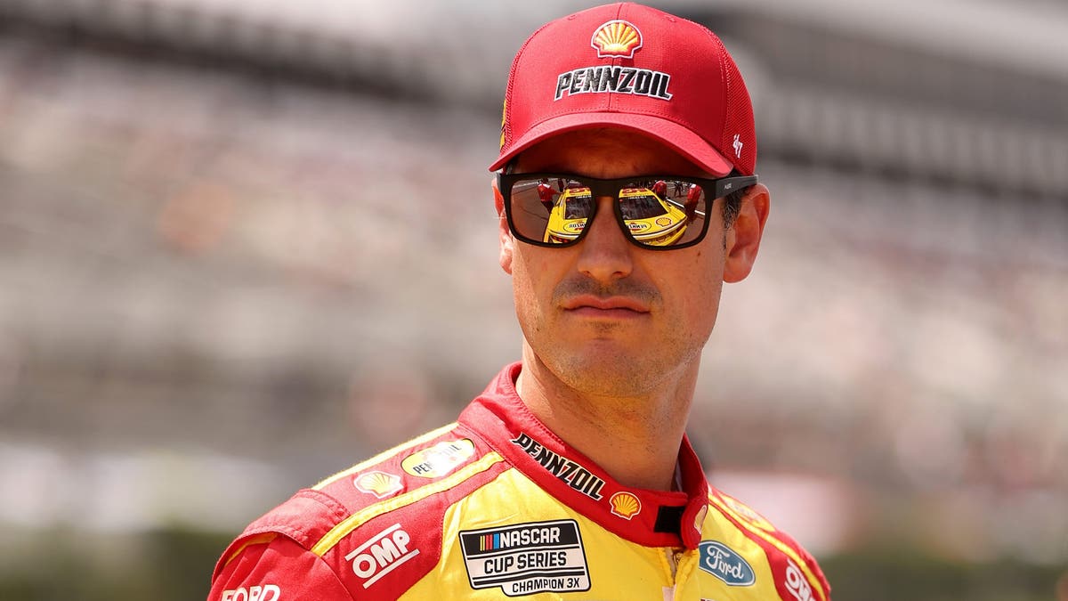 Joey Logano looks on during qualifying for the NASCAR Cup Series The Great American Getaway 400 at Pocono Raceway?