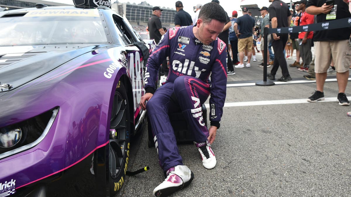Alex Bowman puts on heat shields prior to the running of the NASCAR Cup Series Quaker State 400