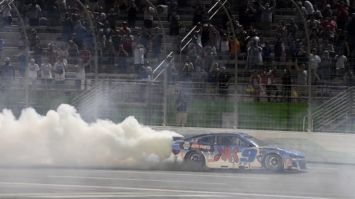 Chase Elliott celebrates following the running of the NASCAR Cup Series Quaker State 400