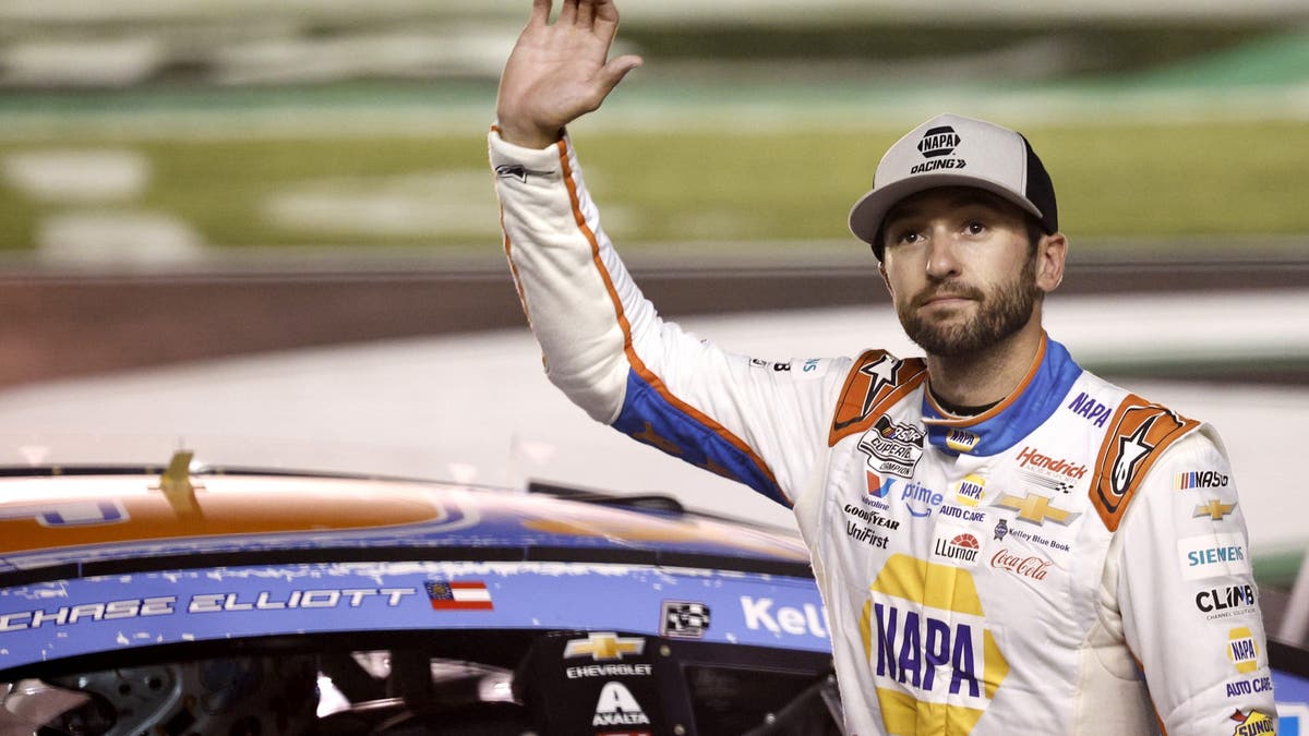Chase Elliott celebrates after winning the NASCAR Cup Series Quaker State 400
